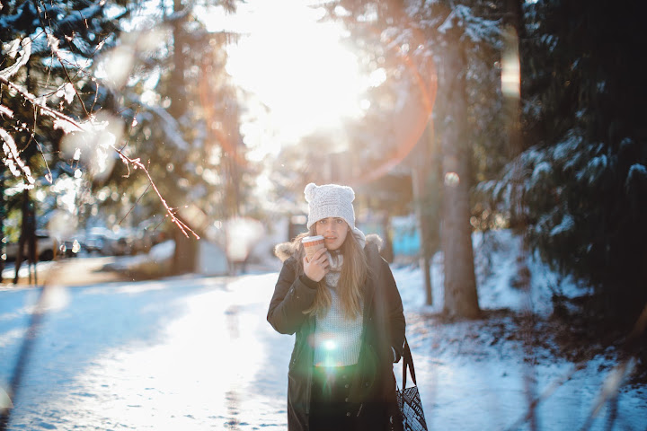 Portrait in sunlit snowy woods