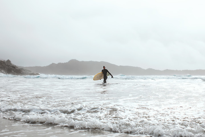 Person looking out across ocean waves