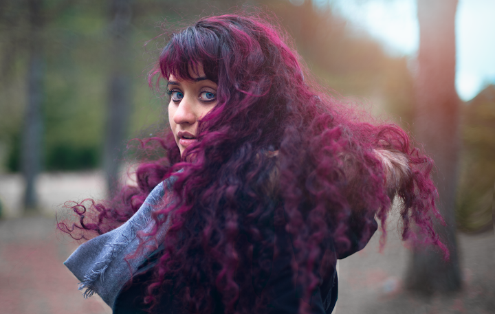 Portrait with flowing red hair outdoors