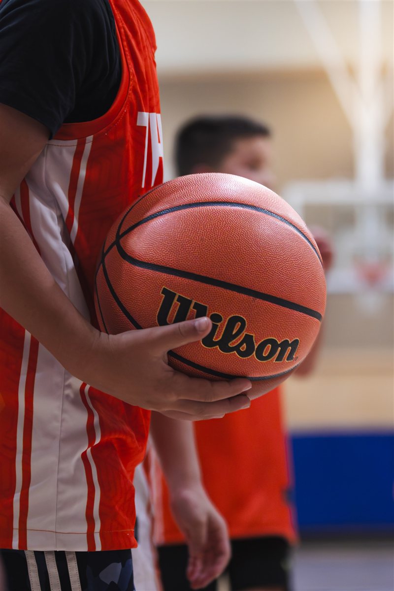 Close-up of a basketball held before play