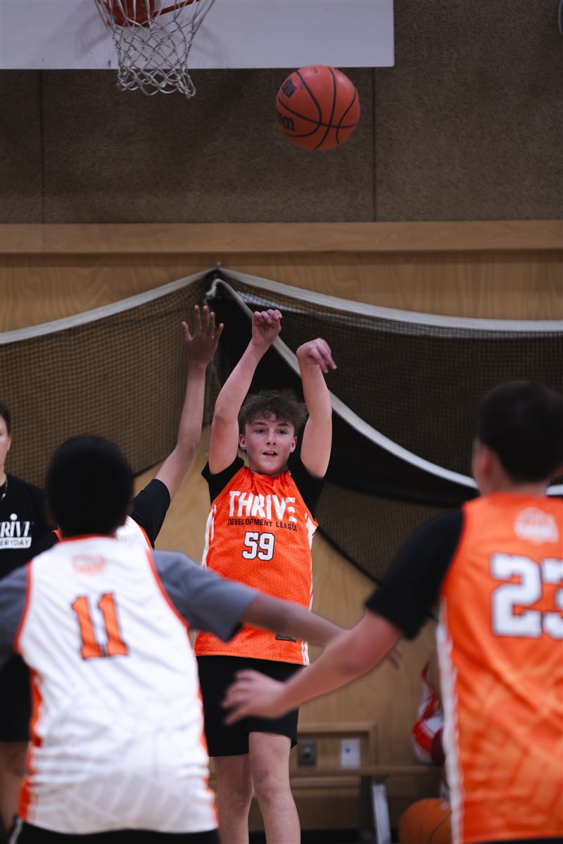 Basketball player shooting toward the hoop