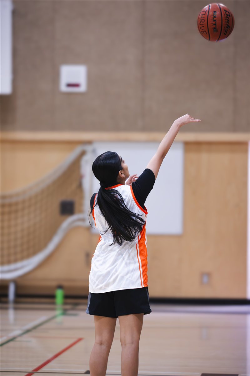 Basketball player following through on a shot