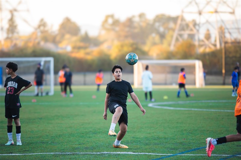 Soccer player tracking the ball during practice