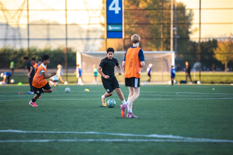 Soccer players training on an outdoor field