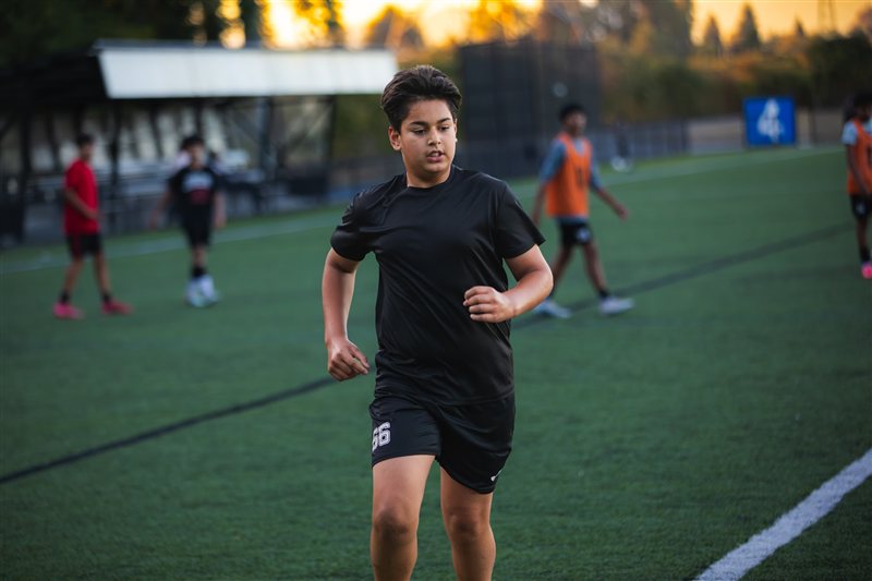 Soccer player running across the field